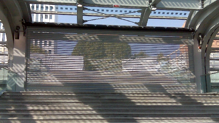 Serrande microforate P97 Traspar. Chiusure accesso Stazione Ferroviaria, Torino